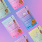 Six Caramunchies pouches on a pink and purple gradient