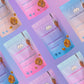 Eight Caramunchies pouches on a pink and purple gradient